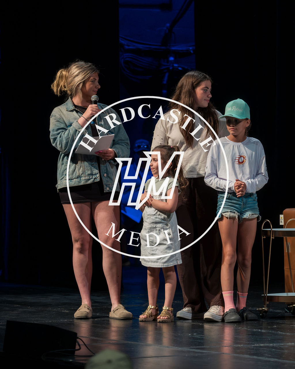 Girls joining the Women of Hockey program on the Fredericton Playhouse stage